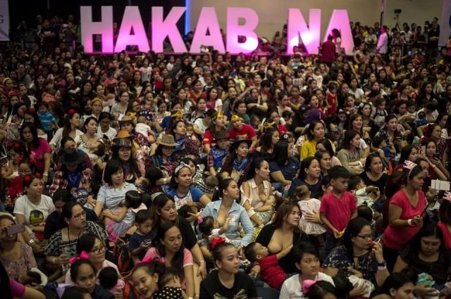 Hundreds of women and their children participate in the Hakab Na! breastfeeding event in the Mall of Asia Complex in Pasay City on August 5, 2018. The government-backed mass breastfeeding event aims to combat child deaths. Noel Celis/AFP