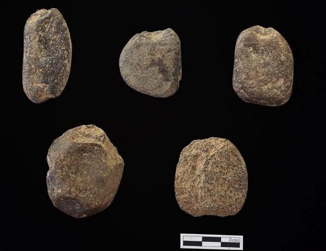 This undated handout released on August 7, 2018 by Yonsei University Museum shows fishing net sinkers unearthed at Maedun cave in the eastern county of Jeongseon in June. Handout/Yonsei University Museum/AFP