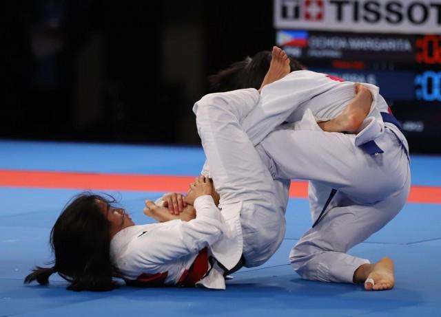 Margarita Ochoa (left) of the Philippines battles Deepudsa Siramol of Thailand during their womenâ€™s 49kg ju-jitsu match. Asian Games 2018 Philippine Media Pool