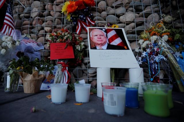 A makeshift memorial stands outside the offices of the late U.S. Senator John McCain in Phoenix, Arizona, U.S., August 28, 2018. REUTERS/Brian Snyder