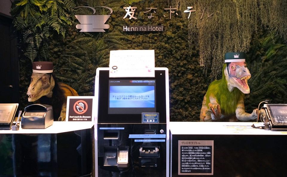 A pair of robot dinosaurs wearing bellboy hats welcome guests from the front desk at the Henn-na Hotel in Urayasu, suburban Tokyo on August 31, 2018. Kazuhiro Nogi/AFP