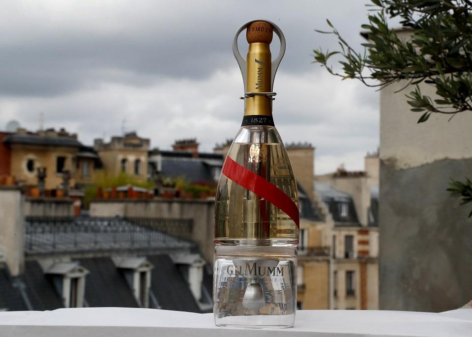 A picture taken on September 6, 2018 in Paris shows a bottle of Mumm Grand Cordon Stellar champagne, designed by French Interior designer Octave de Gaulle, that will be drunk by space tourists using a container bottle adapted to pour the bubbly liquid in zero gravity conditions. Francois Guillot/AFP