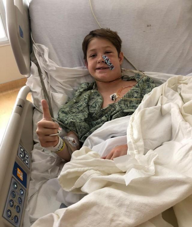 This image courtesy of Shannon Miller shows Miller's stepson, Xavier Cunningham, 10, recovering at a hospital after surgery in Kansas City, Missouri. A meat skewer impaled his skull on September 8, 2018, but missed his brain, in what medics called a "one in a million" accident. Shannon Miller/Family Photo/AFP