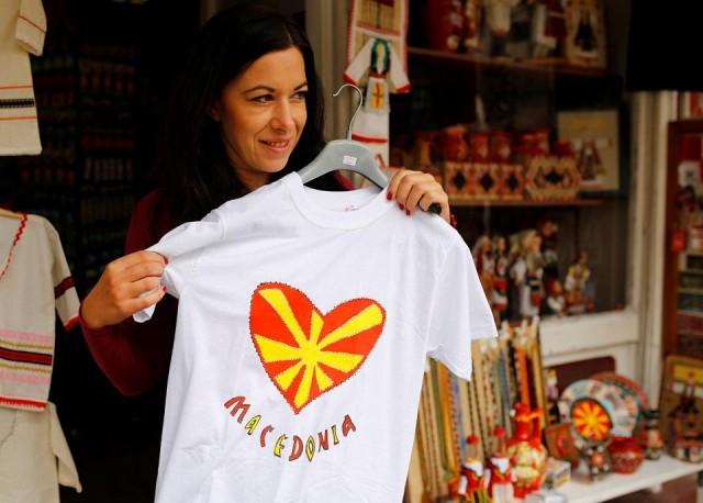A tourist looks at souvenirs with the Macedonian flag on them at the Old Bazar in Skopje, Macedonia September 29, 2018.REUTERS/Ognen Teofilovski