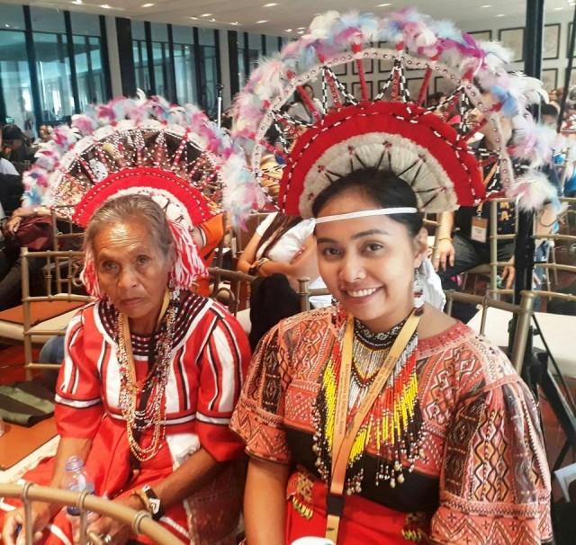 Chanter Florena Binatao Saway, also known as Bai Balag-ulaging to the Talaandig community (left) and youth leader Aduna Saway, daughter of Datu Migketay Victorino (right) await the chant performance after the sessions.
