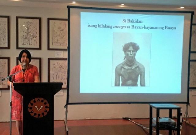 Dr. Felicidad Prudente shows a photo of a mengo (headhunter) from Buaya Kalinga