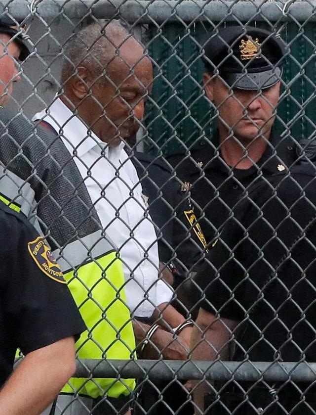 Actor and comedian Bill Cosby leaves the Montgomery County Courthouse in handcuffs after sentencing in his sexual assault trial in Norristown, Pennsylvania, U.S., September 25, 2018. REUTERS/Brendan McDermid