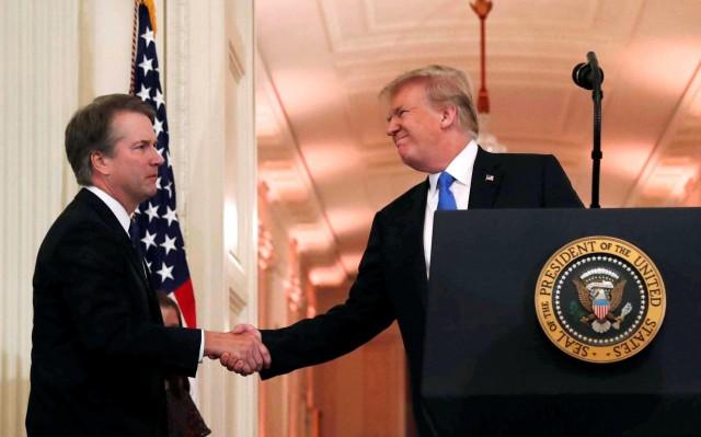 U.S. President Donald Trump introduces his Supreme Court nominee judge Brett Kavanaugh (L) in the East Room at the White House in Washington, U.S., July 9, 2018. REUTERS/Leah Millis/File Photo