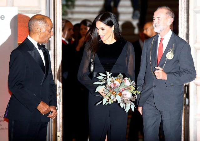 Britain's Meghan, the Duchess of Sussex, leaves after attending the opening of 'Oceania' at the Royal Academy of Arts in London, Britain September 25, 2018. REUTERS/Henry Nicholls
