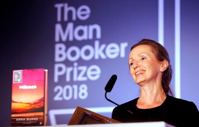 Writer Anna Burns smiles after she was presented with the Man Booker Prize for Fiction 2018 by Britain's Camilla, the Duchess of Cornwall, during the prize's 50th year at the Guildhall in London, United Kingdom, October 16, 2018. Frank Augstein/Pool via REUTERS