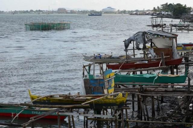 This photo taken on November 1, 2018 shows wooden fishing boats resting on stilts along the coastal area in Tacloban City, Leyte province. Typhoon Yolanda struck in the predawn darkness of November 8, 2013 as the then strongest typhoon to ever hit land, leaving more than 7,360 people dead or missing across the central Philippines. Ted ALJIBE / AFP