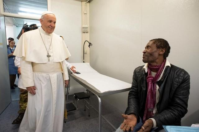 This handout photo taken and released by the Vatican press office, the Vatican Media, on November 16, 2018 shows Pope Francis visiting the First Aid Station for Poor and Homeless in Saint Peter's Square at the Vatican. Handout/Vatican Media/AFP