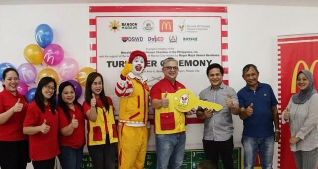 McDonald&acirc;s Philippines and Ronald McDonald House Charities (RMHC) turns over the Ronald McDonald Bahay Bulilit to the local government unit of Marawi. (From left) McDonald's Philippines Senior Market Manager Eloisa Dayrit, McDonald's Philippines AVP for Franchising and Field Service Rebecca Roselada, RMHC Executive Director Marie A. Angeles, McDonald's Philippines Corporate Communications Head and RMHC Board Member Adi Hernandez, McDonald&acirc;s Philippines Chief Happiness Officer Ronald McDonald, McDonald&acirc;s Philippines Vice President for Finance Robert Ramos, Marawi City Mayor Majul Usman Gandamra, Engr. Sirad Daligdig, and Marawi City Senior Consultant on Health and Social Services Dr. Emelda Gandamra-Taib. PHOTO COURTESY OF RONALD MCDONALD HOUSE CHARITIES.