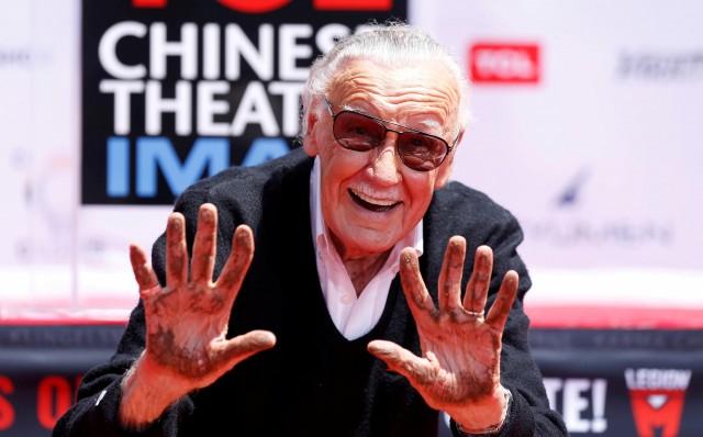 Marvel Comics co-creator Stan Lee shows his hands after placing them in cement during a ceremony in the forecourt of the TCL Chinese theatre in Los Angeles, California, U.S., July 18, 2017. REUTERS/Mario Anzuoni