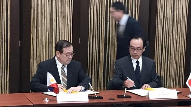 DFA Secretary Teodoro Locsin Jr. and Japanese Ambassador Koji Haneda sign and exchange documents on the Japanese government's commitments to provide Â¥206 billion (P95.2 billion) in loans to the Philippines on November 21, 2018. Ted Cordero