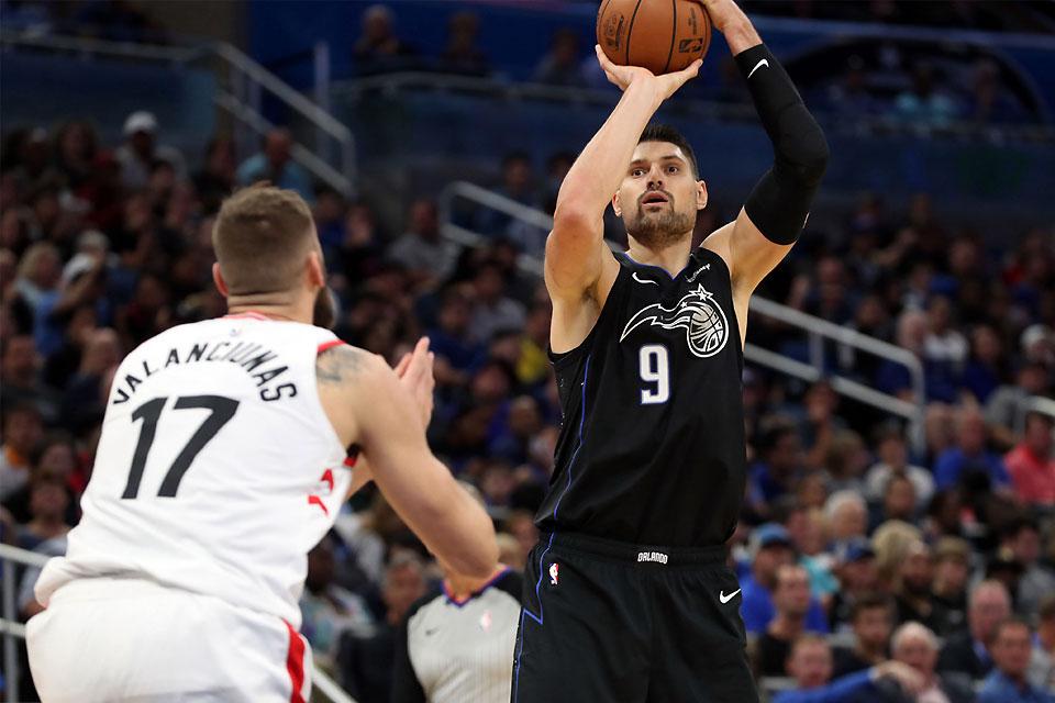 Orlando Magic center Nikola Vucevic (9) shoots over Toronto Raptors center Jonas Valanciunas (17) during the second half of their game at Amway Center in Orlando, Florida on Tuesday, Noveember 20, 2018. The Raptors defeat the Magic, 93-91. Reuters/Kim Klement-USA TODAY Sports