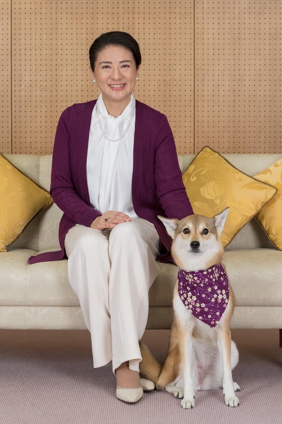 Japan's Crown Princess Masako, wife of Crown Prince Naruhito, poses for a photograph with her pet dog Yuri at Togu Palace in Tokyo on December 4, 2018. She celebrated her 55th birthday on December 9, 2018. AFP photo/Imperial Household Agency of Japan/Handout