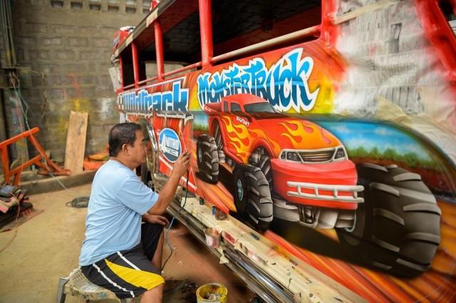 As the government runs jeepneys gradually off the road due to pollution and safety concerns, artists like Capunoâ€”seen here on November 29, 2018â€”and their work are going too. Ted Aljibe/AFP