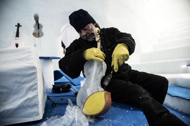 US artist Tim Linhart works on an ice violin in the Ice Dome on Presena Galcier, Tonale Pass, near Trento in northern Italy on January 18, 2018. Marco Bertorello/AFP