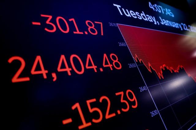 A screen displays the Dow Jones Industrial Average following the close of trading on the floor of the New York Stock Exchange (NYSE) in New York, US, January 22, 2019. REUTERS/Brendan McDermid