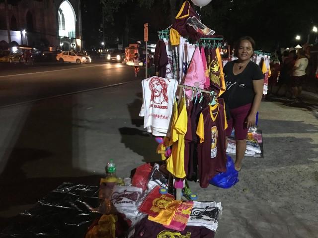 Maria Fe Rivera, from Caloocan City, sells Nazareno merchandise every year to help spread the devotion and earn a few pesos at the same time. PHOTO BY ANNA FELICIA BAJO