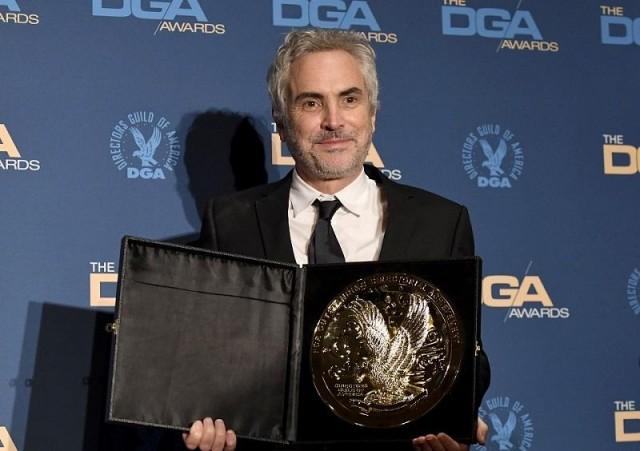 DGA Feature Film Award winner for 'Roma' Alfonso Cuaron poses in the press room during the 71st Annual Directors Guild Of America Awards at The Ray Dolby Ballroom at Hollywood & Highland Center on February 02, 2019 in Hollywood, California. Frazer Harrison/Getty Images/AFP 