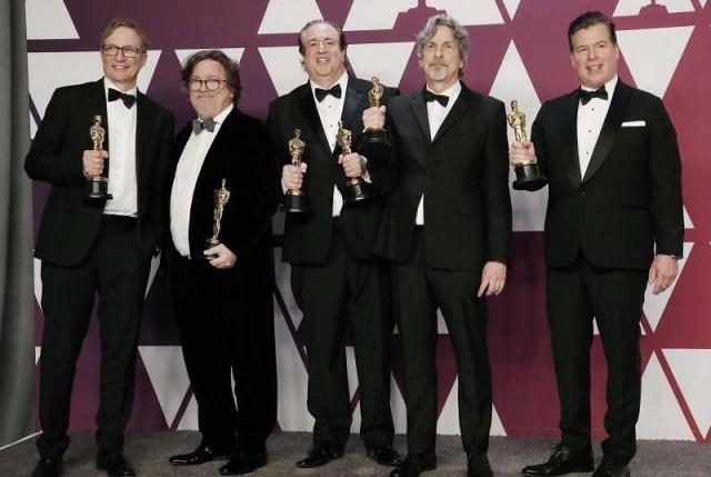 "Green Book" producers Jim Burke, Charles Wessler, Nick Vallelonga, Peter Farrelly and Brian Hayes Currie pose backstage with their Best Picture awards. REUTERS/Mike Segar