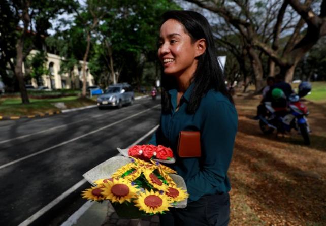 Filipino lawyer and entrepreneur Alex Castro holds bouquets of origami flowers to delivered to clients in Quezon City, Philippines, February 13, 2019. REUTERS/Eloisa Lopez