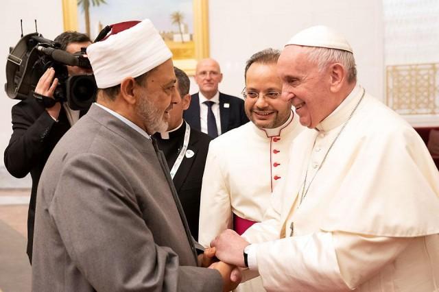 Pope Francis, head of the Catholic Church, shakes hands with Sheikh Ahmed Mohamed el-Tayeb, Egyptian Imam of al-Azhar Mosque, upon his arrival at Abu Dhabi International Airport in United Arab Emirates on Sunday, February 3, 2019. WAM/Reuters 