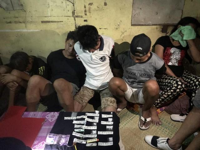 The 14-year-old boy (far left) was used by his father as a courier in his drug transactions.