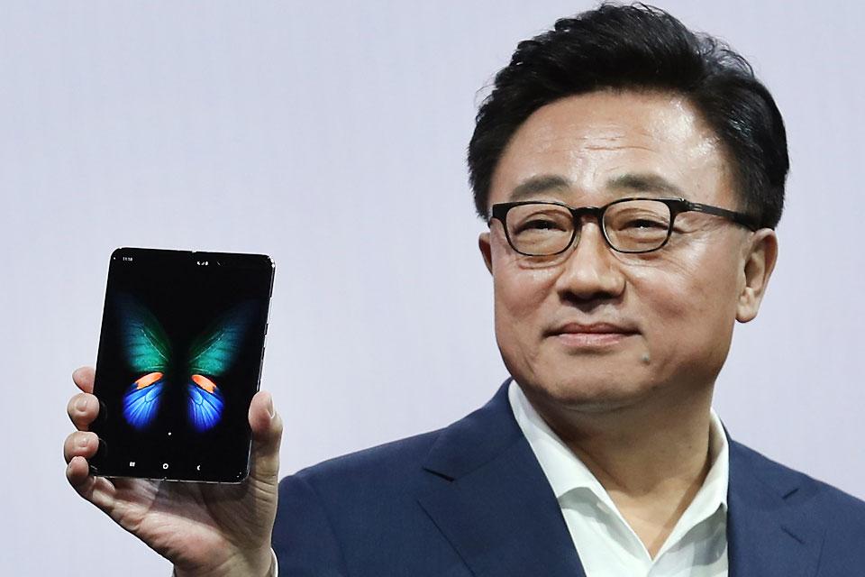 Samsung's Mobile Division President and CEO DJ Koh holds the new Samsung Galaxy Fold smartphone during the Samsung Unpacked event on Wednesday, February 20, 2019 in San Francisco, California. Samsung announced a new foldable smartphone, the Samsung Galaxy Fold, as well as a new Galaxy S10 and Galaxy Buds earphones. Justin Sullivan/Getty Images/AFP 