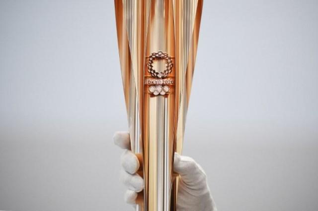 The Tokyo 2020 Olympic Games torch for the torch relay is displayed in Tokyo on March 20, 2019. CHARLY TRIBALLEAU / AFP