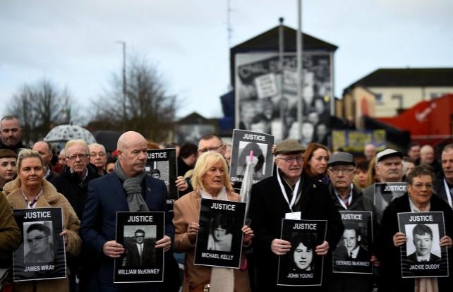 Families of the victims walk through the Bogside before the announcement of the decision whether to charge soldiers involved in the Bloody Sunday events, in Londonderry, Northern Ireland March 14, 2019. REUTERS/Clodagh Kilcoyne