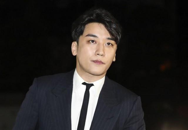 This picture taken on February 27, 2019 shows Seungri, a member of popular K-pop boy group Big Bang, arriving for questioning over criminal allegations at the Seoul Metropolitan Police Agency in Seoul. Seungri announced his retirement from show business amid mounting criminal allegations over his involvement in a sex-for-business favor deal. YONHAP / AFP