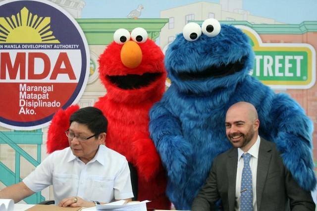 MMDA Chairman Danilo Lim and Sesame Workshop director for Asia-Pacific Will De Pippo sign an agreement for a three-year educational drive which will aim to help kids and families learn about road safety, the environment, and emergency awareness, at the Children's Road Safety Park in Malate on Monday, March 18, 2019. Danny Pata