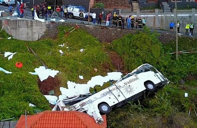 A video grab obtained from drone footage shows the wreckage of a tourist bus that crashed on April 17, 2019 in Canico, on the Portuguese island of Madeira. Stringer/AFP