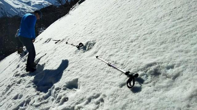 In this handout photo taken by the Indian Army on April 9, 2019, Indian men measure large footprints in the snow, sighted near the Makalu Base Camp in the North-Eastern Himalayas. Pictures of a "Yeti footprint" the Indian Army posted on social media have triggered a barage of mockery. Handout/Indian Army/AFP