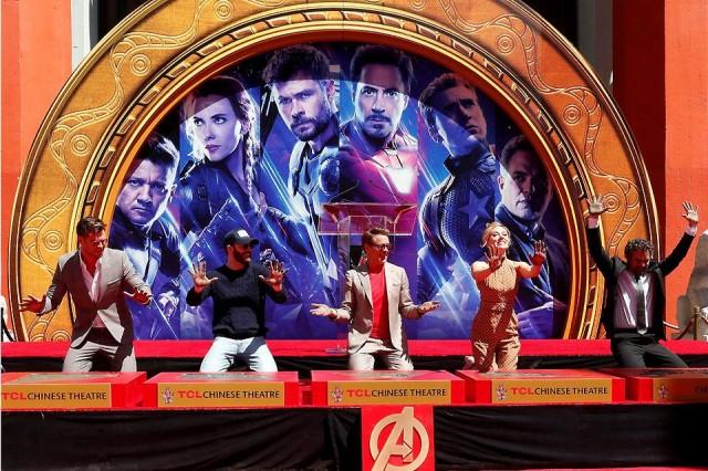 Actors Chris Hemsworth, Chris Evans, Robert Downey Jr., Scarlett Johansson and Mark Ruffalo show their hands after placing their handprints in cement at a ceremony at the TCL Chinese Theatre in Hollywood, Los Angeles, California on Tuesday, April 23, 2019. Reuters/Mario Anzuoni
