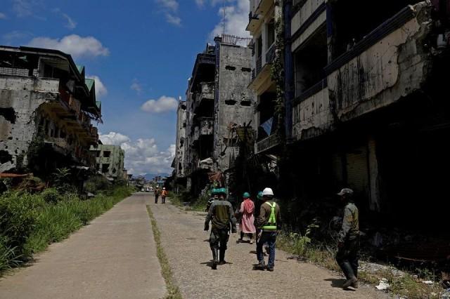 The visit is intended for IDPs to give consent to demolish their houses as the government begins rehabilitation two years after the Marawi siege. REUTERS/Eloisa Lopez