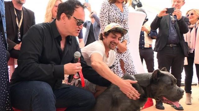 US film director Quentin Tarantino poses with stand-in hound Haru as he attends the Palm Dog on the sidelines of the 72nd edition of the Cannes Film Festival in Cannes, southern France, on May 24, 2019. Natalie HANDEL / AFP