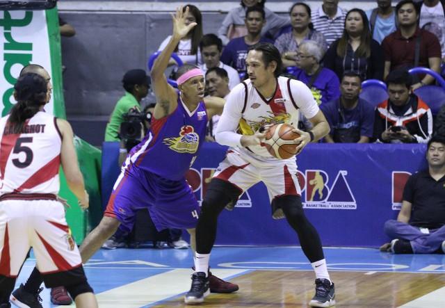 Rafi Reavis of Magnolia Hotshots guards San Miguel Beermen's June Mar Fajardo in Game 6 of the PBA Philippine Cup Finals. PHOTO BY ZEKE ALONZO