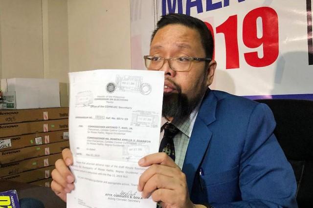 Comelec spokesperson James Jimenez on Monday, May 6, 2019, shows an advanced copy of the Comelec resolution placing Moises Padilla town in Negros Occidental under its control due to various incidents of violence. Tina Panganiban-Perez