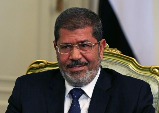 File photo of Egypt's President Mohamed Mursi participates in a meeting with US Defense Secretary Leon Panetta at the presidential palace in Cairo July 31, 2012. REUTERS/Mark Wilson