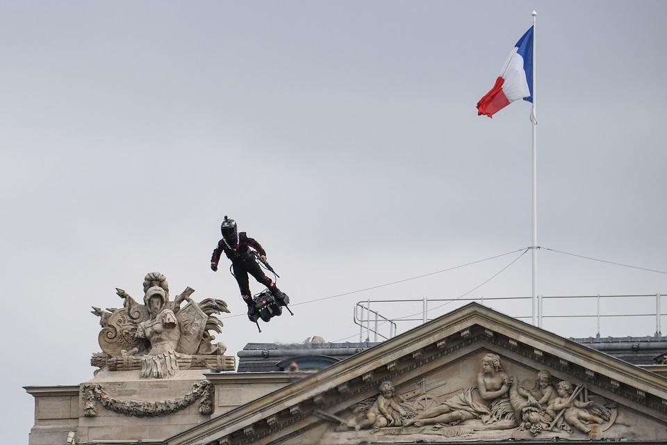 Zapata CEO Franky Zapata flies a jet-powered hoverboard or "Flyboard" prior to the Bastille Day military parade down the Champs-Elysees avenue in Paris on July 14, 2019. Alain Jocard/AFP