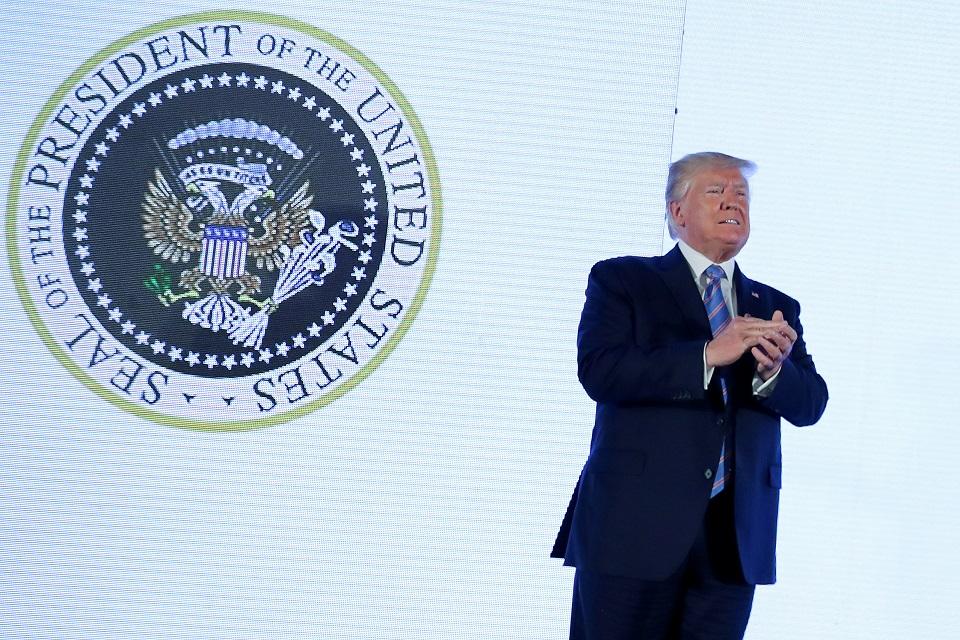 US President Donald Trump takes the stage next to an altered presidential seal prior to a speech at Turning Point USA's Teen Student Action Summit in Washington, DC, July 23, 2019. REUTERS/Jonathan Ernst