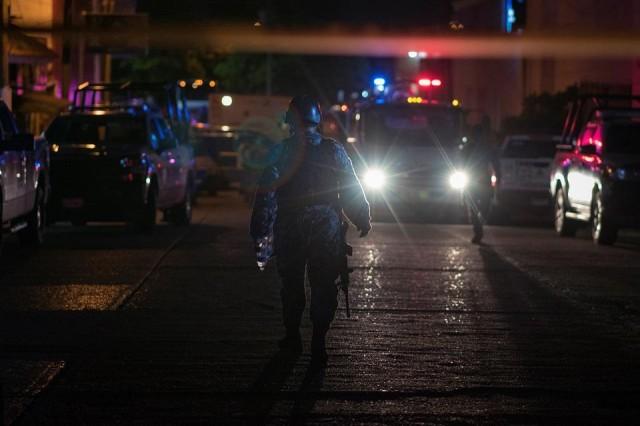 Police officers walk at a crime scene following a deadly attack at a bar by unknown assailants in Coatzacoalcos, Mexico August 28, 2019. REUTERS/Angel Hernandez