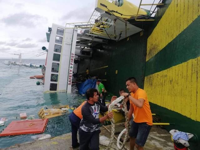 &acirc;SAFETY FIRST.&acirc; A passenger vessel docked on Camotes Island in Cebu lists after a rolling vehicle inside Mika Mari 8 was thrown off balance. All passengers got out safely. PCG 