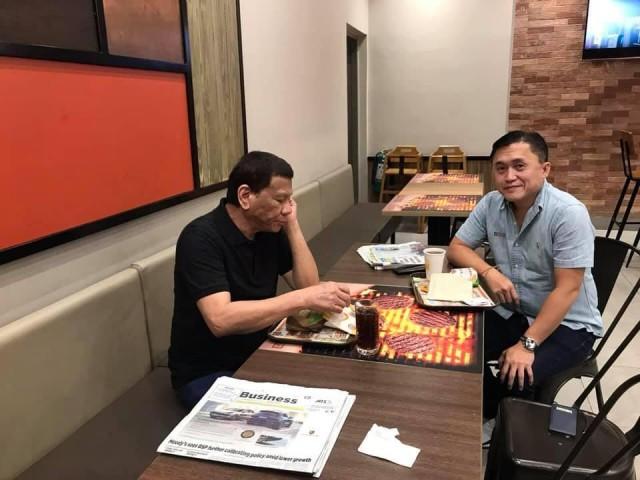 President Rodrigo Duterte and Senator Bong Go share a burger meal, read newspapers. PHOTO BY SEN. BONG GO