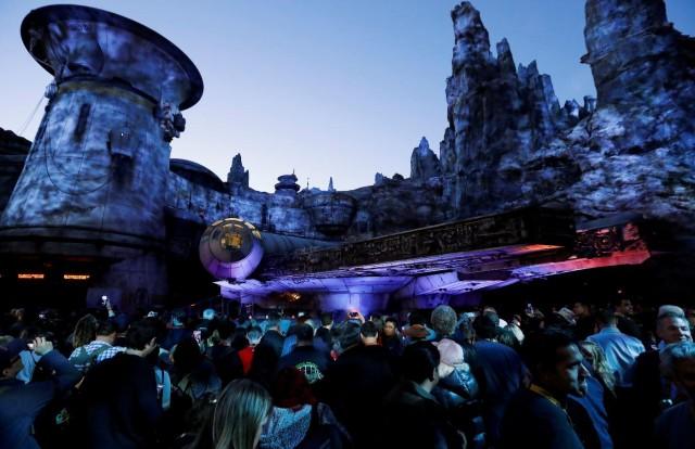 File photo of guests explore Star Wars Galaxy's Edge near a Millennium Falcon starship at Disneyland Park in Anaheim, California, U.S., May 29, 2019. REUTERS/Mario Anzuoni