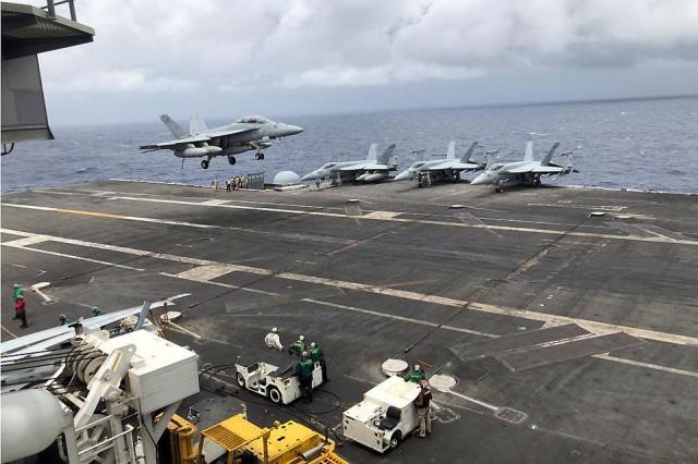 An F18 fighter jet lands on the USS Ronald Reagan somewhere in the West Philippine Sea on Wednesday, August 7, 2019. Chino Gaston 
